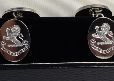 Cuff links in sterling silver and engraved with lion crest and motto